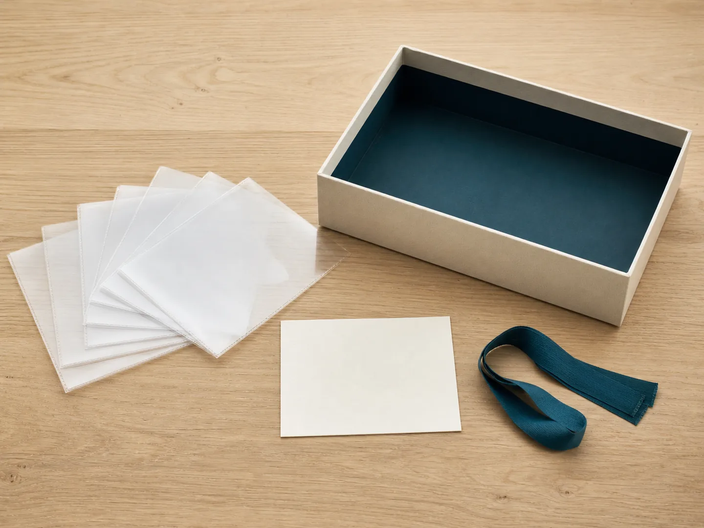 Archive box, photo sleeves, and card help preserve the provenance of family materials