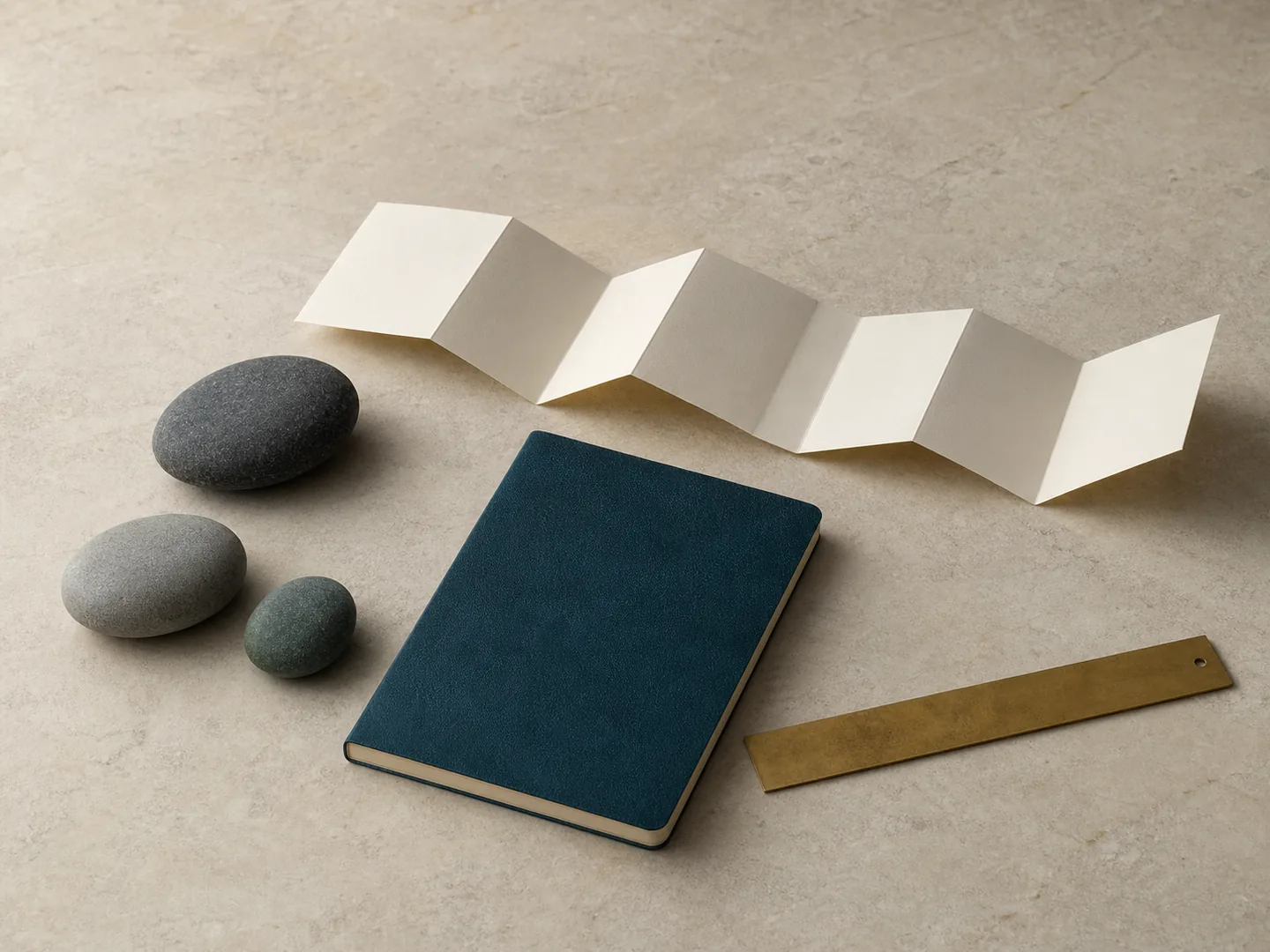Folded route, stones, and notebook represent stops and practical planning